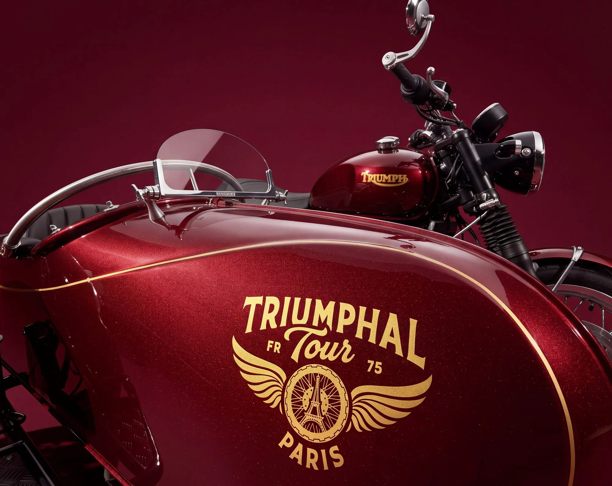 Wide-angle view of the red sidecar body, golden Triumphal Tour logo