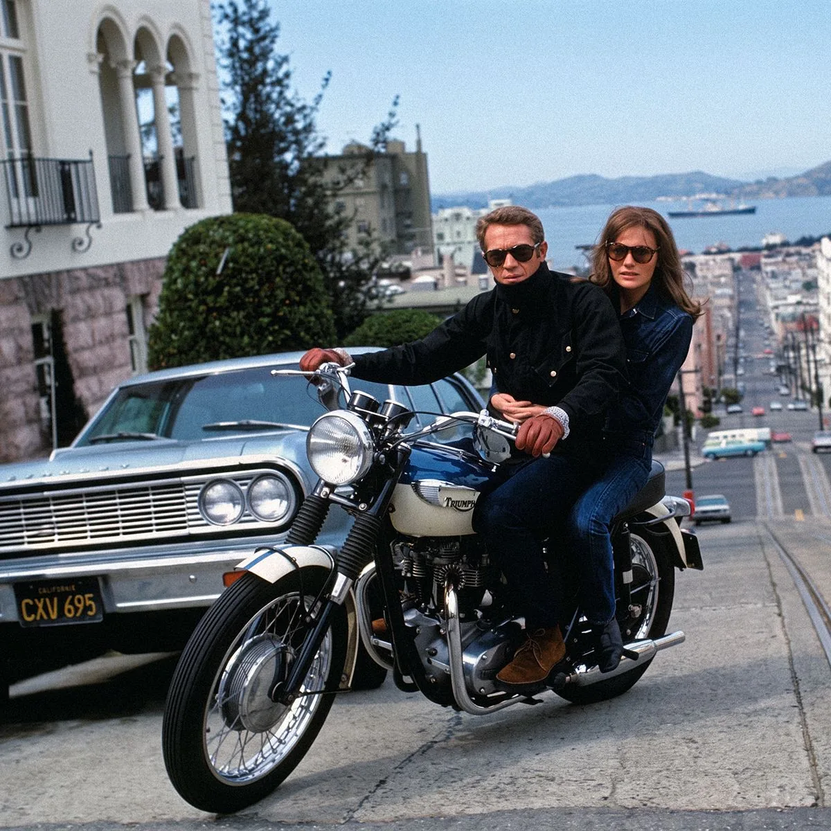 Couple on a motorcycle in New Wave style, heritage of cinema legends