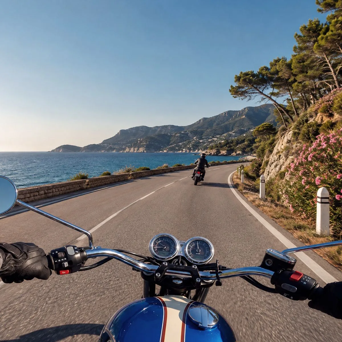 Handlebars of a Triumph on a coastal road